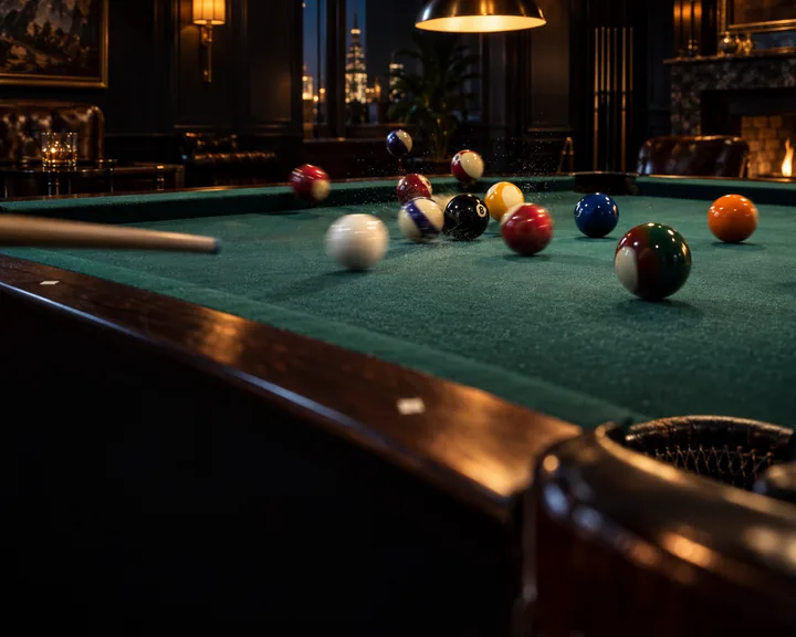 The break: balls scattering across green felt